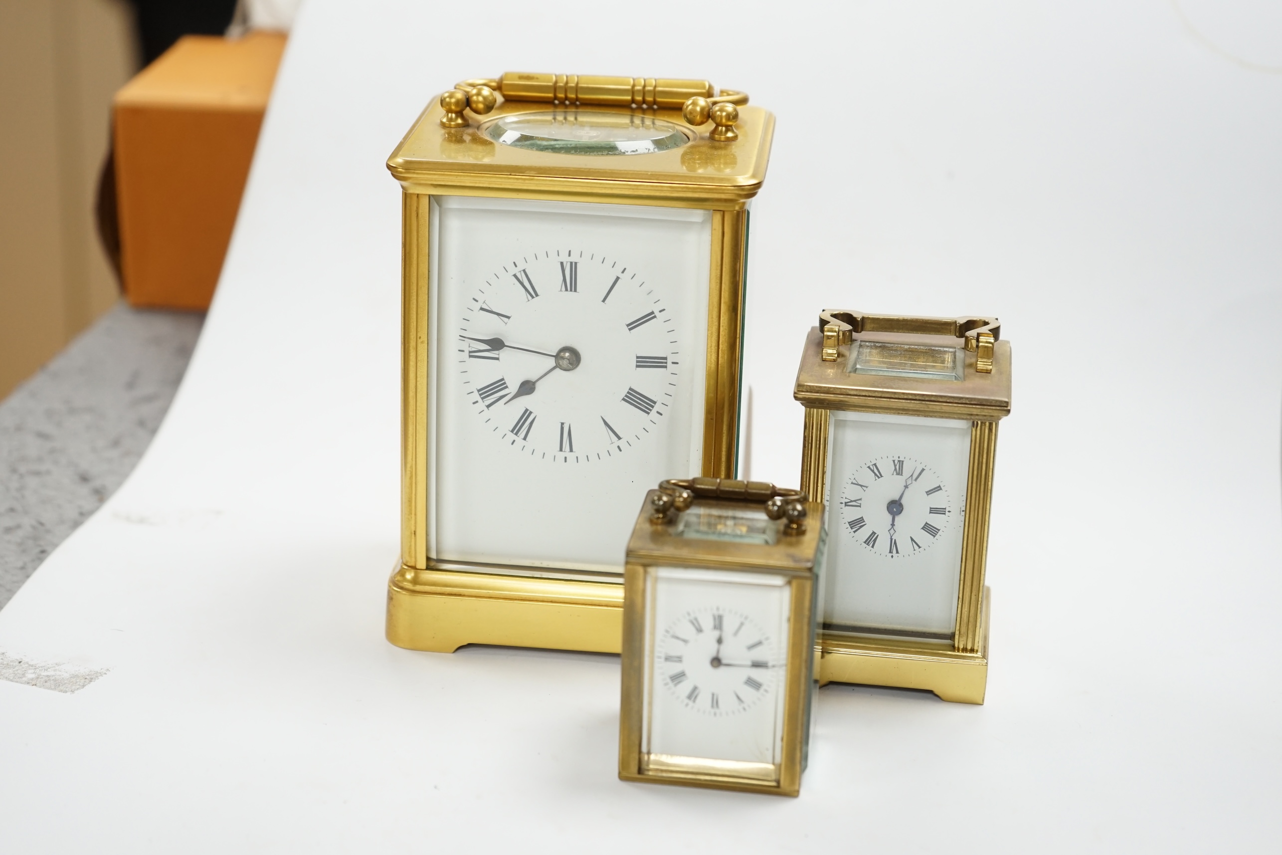 A French carriage clock and two other miniature carriage clocks, largest 13cm high. Condition - fair to good, not tested as working